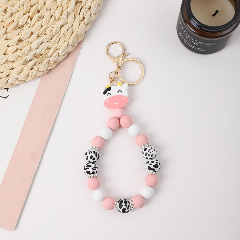 Wholesale Rubber Tassel Silicone Wood Water Keychain
